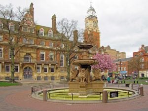 An image of Leicester Town Hall with the Town Hall Square fountain in the foreground.